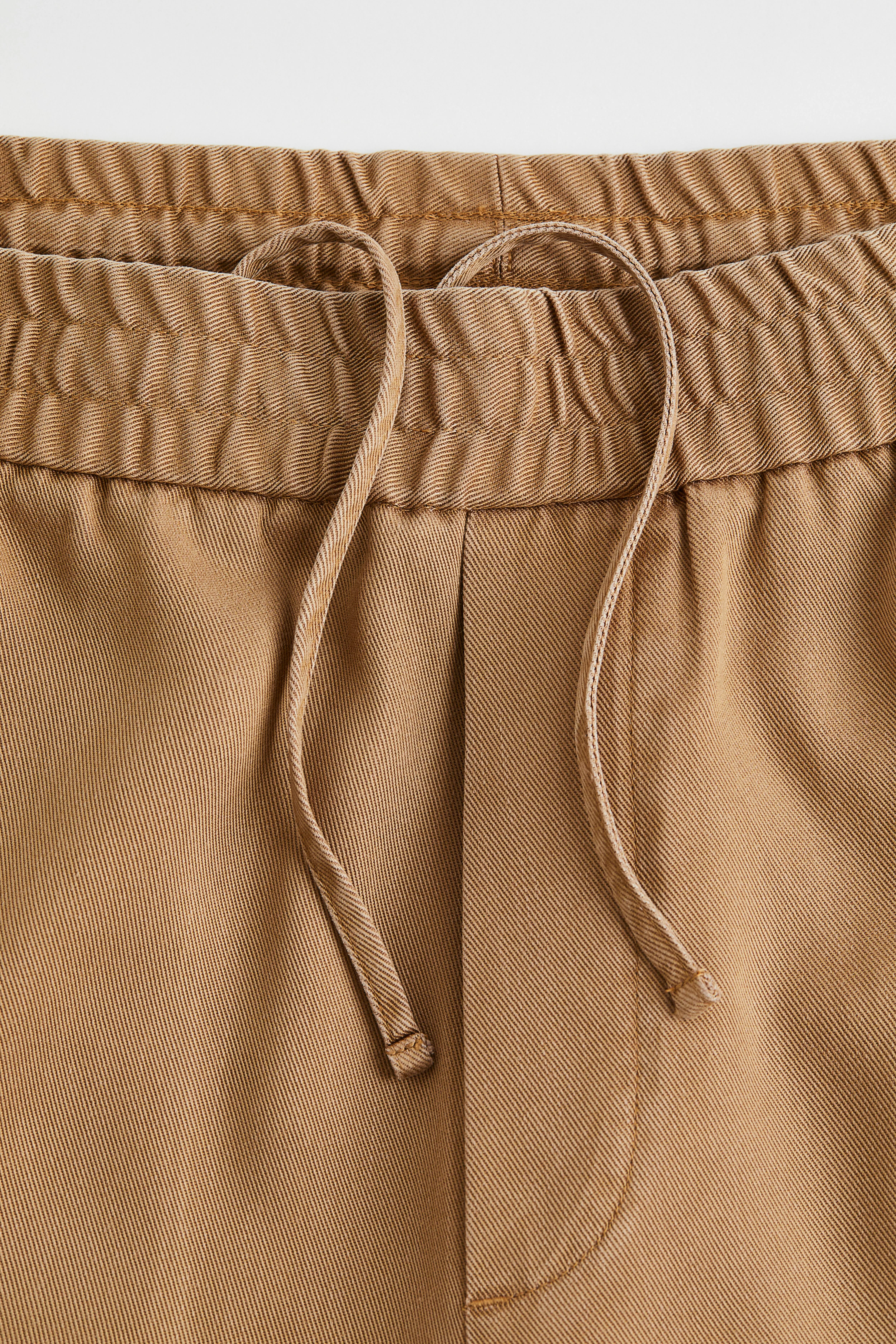 Loose Fit Lyocell joggers - Regular waist - Long - Beige - Men | H&M GB