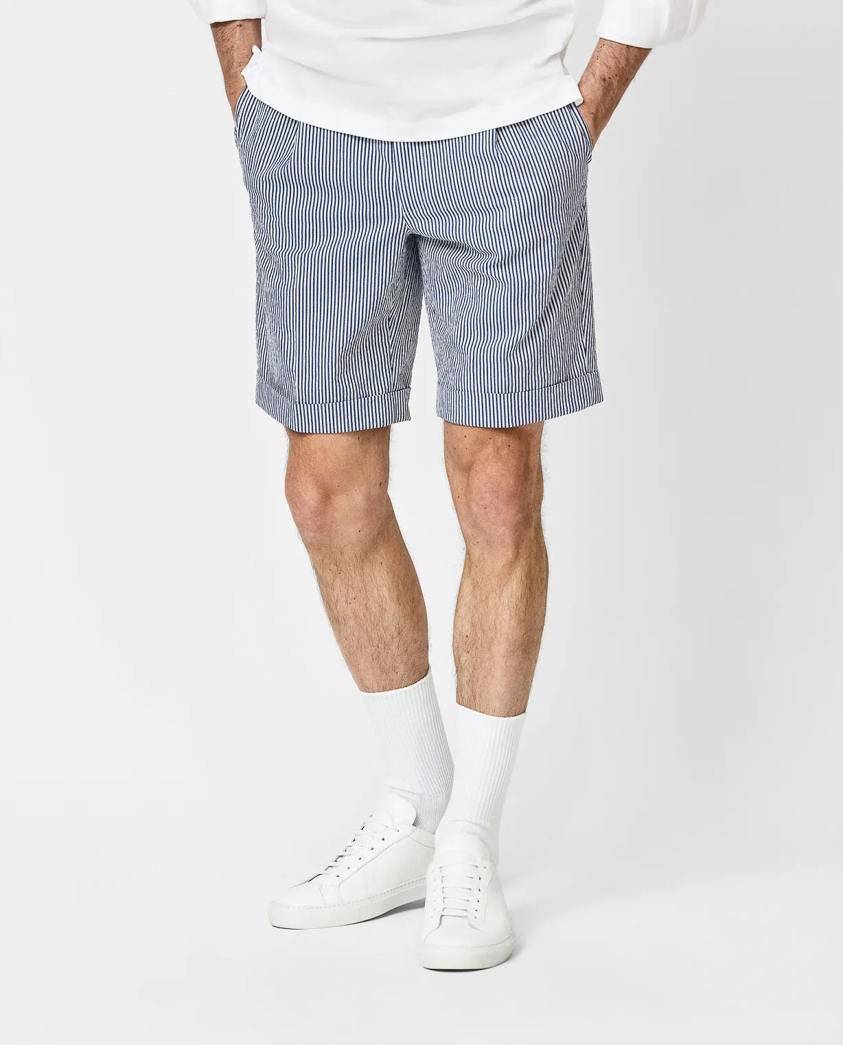 White popover, seersucker stripe shorts, & sneakers